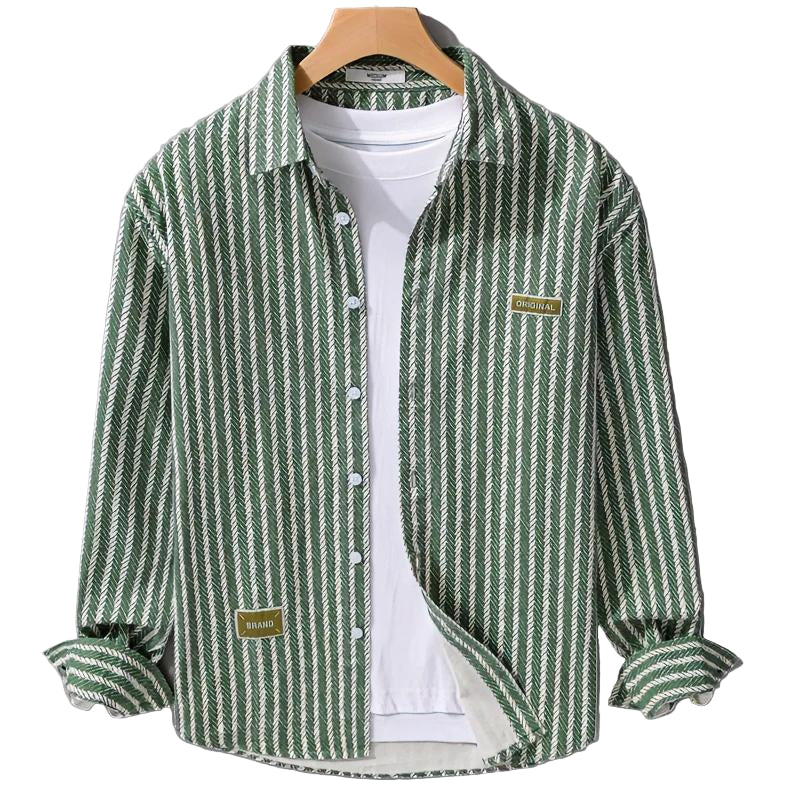 Green and white striped shirt on a hanger against a gray background