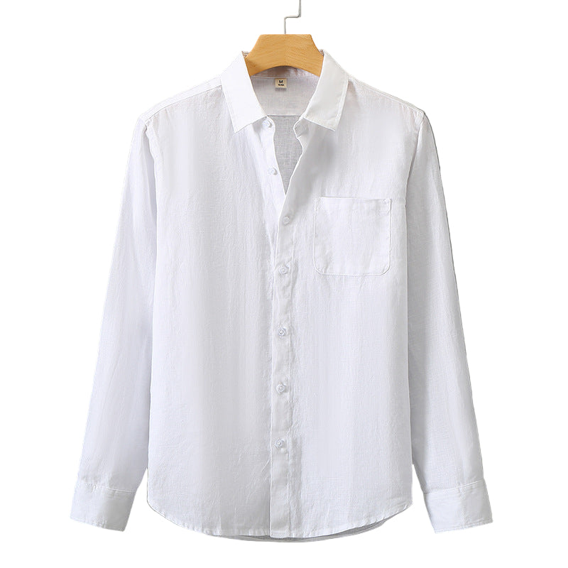 White shirt on a wooden hanger against a gray background