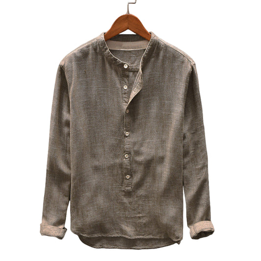 Brown button-up shirt on a wooden hanger against a gray background