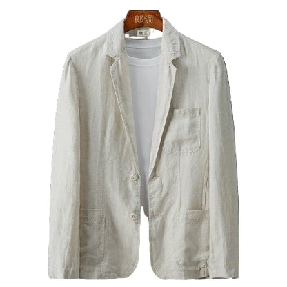 Light-colored blazer over a white shirt on a dark gray background