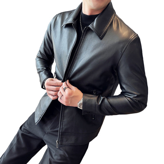 Person wearing a black leather jacket indoors
