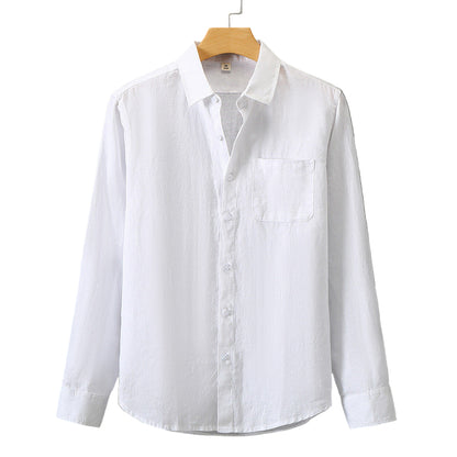 White shirt on a wooden hanger against a gray background